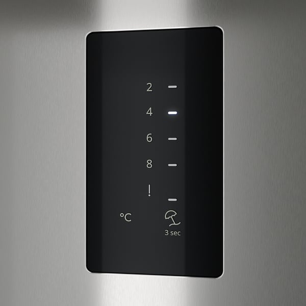 Control panel with temperature settings and alarm indicators.