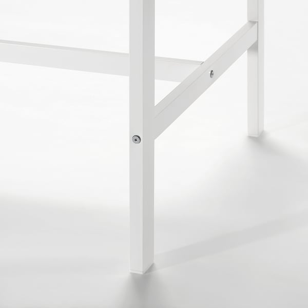 White metal table leg with adjustable foot for stability.
