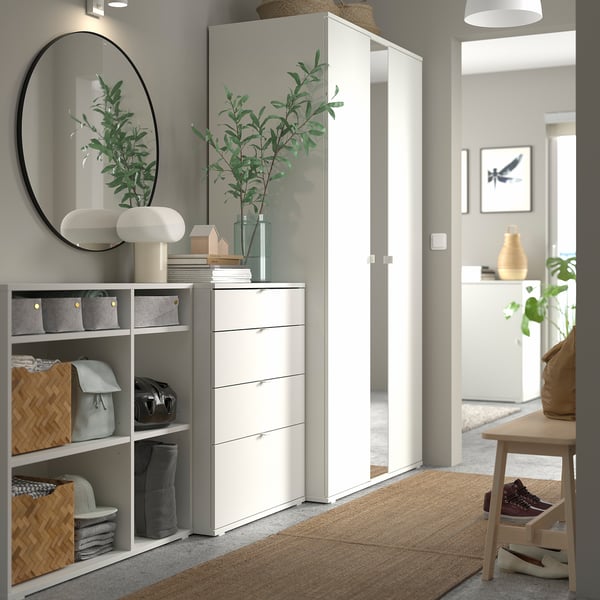 Minimalist entryway with ikea VIHALS storage, shelves, drawers, wardrobe with mirror, baskets, plants, and bench.