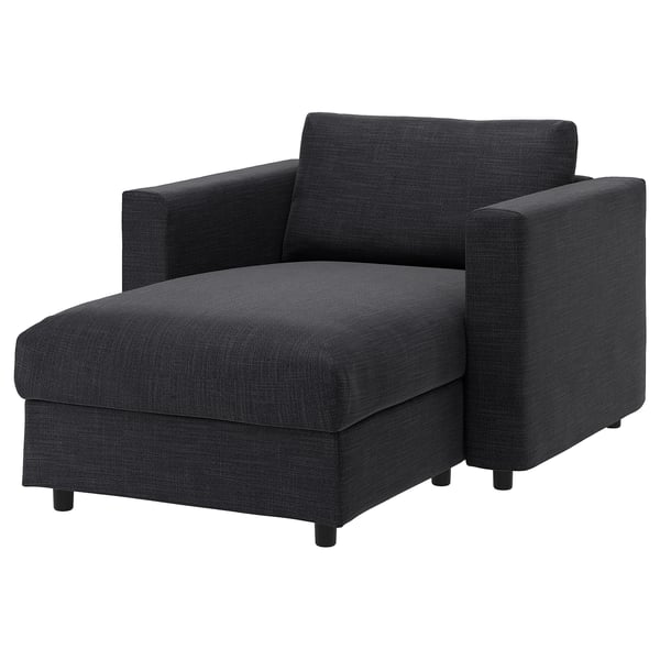 A dark gray VIMLE sectional sofa with a chaise lounge. Its designed for comfort and has a sleek, modern look.