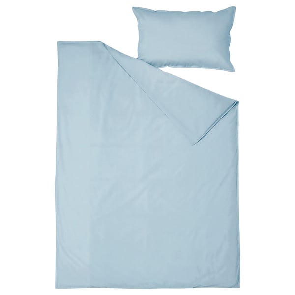Light blue duvet and pillow covers, made from soft cotton, minimalist design.