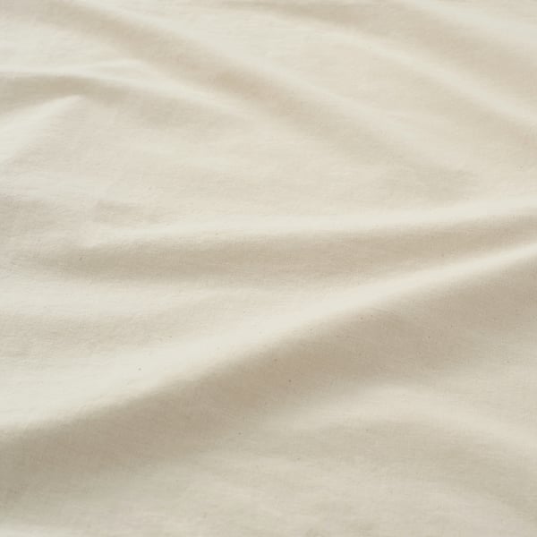 A close-up shot of a soft, textured fabric, likely cotton, displaying its smooth, natural weave and subtle, earthy tone.