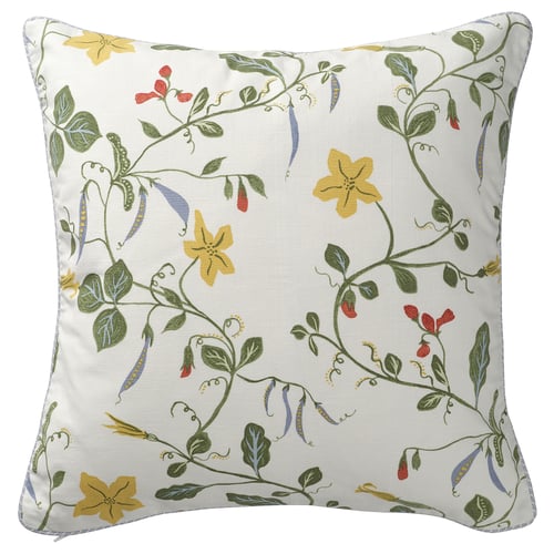 White square pillow with yellow flowers, green leaves, and light blue piping.