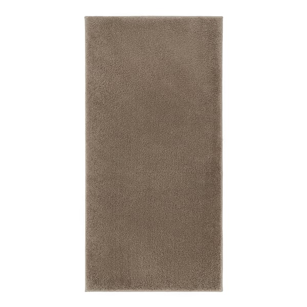 A rectangular, beige BACKMÅRA bath mat with a soft, shaggy texture and latex backing, designed to absorb water and keep its place in the bathroom.