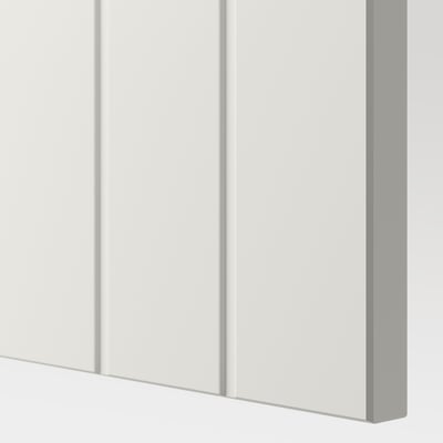 Close-up of white cabinet corner, smooth surfaces, clean lines, quality finish.