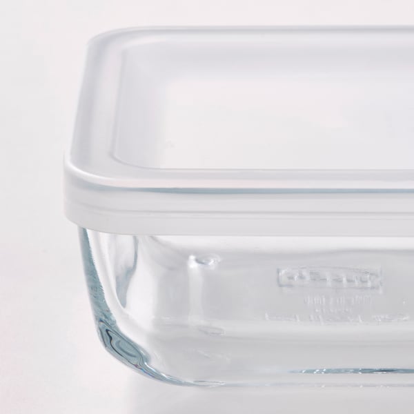 Clear glass food container with a white lid, showcasing durability and transparency for easy visibility.