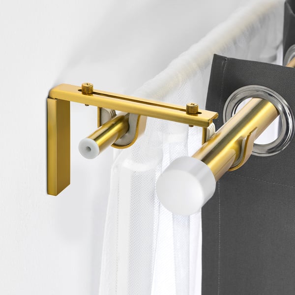 BETYDLIG gold curtain rod holder. Small, elegant, mounts on wall. Holds double rods with anti-slip liners. Nicely designed, compact.