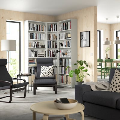 Living room with white BILLY bookcase, grey sofa & coffee table.