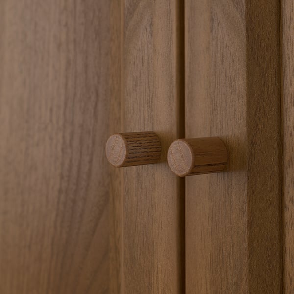 A close-up of wooden handles on a BILLY bookcase, showcasing the natural wood texture and craftsmanship.