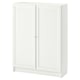 White BILLY bookcase. Simple, square design with two panel doors. Made from particleboard and fibreboard.