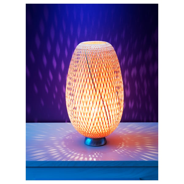 Bamboo lamp BÖJA, warm light, oval shape, intricate patterns.
