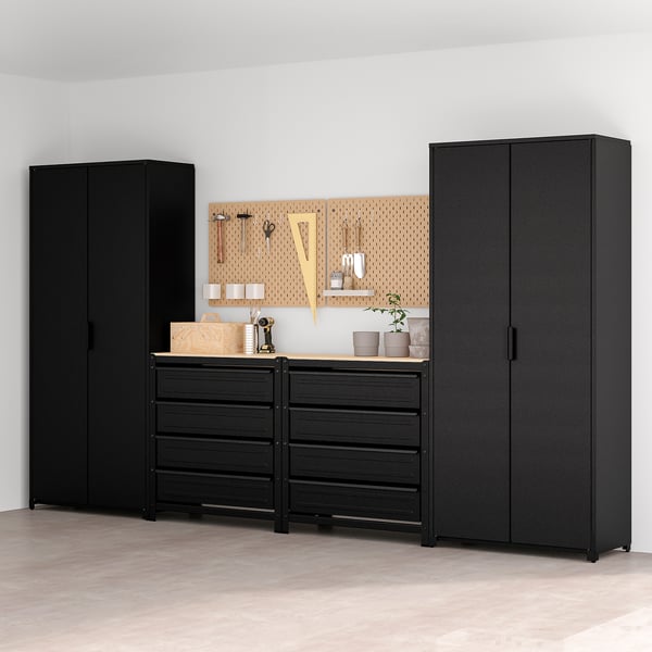 Black BROR storage set: two tall black cabinets, wide drawers, light wood counter, rustic decor.