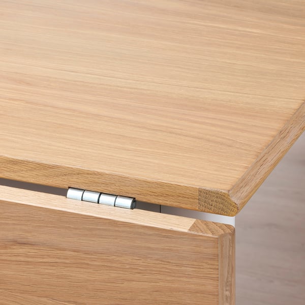 Close-up of DANDERYD drop-leaf table hinge, showcasing sturdy craftsmanship and precise finish.