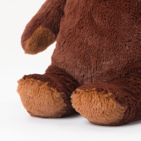 Close-up of plush teddy bears feet; soft, detailed fur texture.