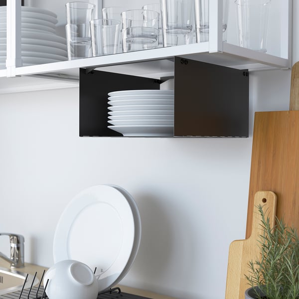 Kitchen shelf organiser, ENHET brand, holding glasses and plates, with a side compartment for additional storage.