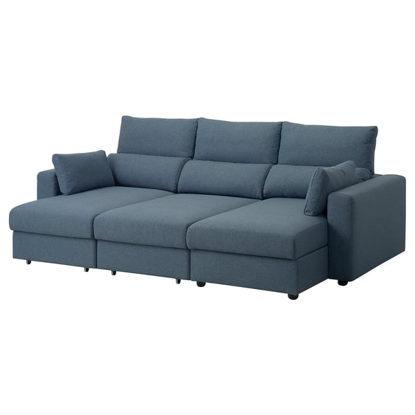 Blue sofa with extra-high back, adjustable headrests, and detachable chaise longue sections. Modern, comfortable design for relaxation.