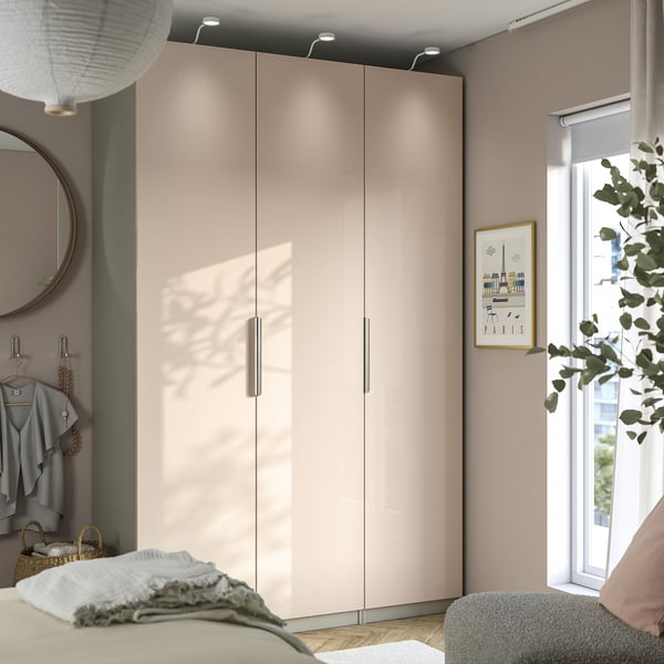 Modern beige FARDAL wardrobe, malm furniture, cosy bedding.