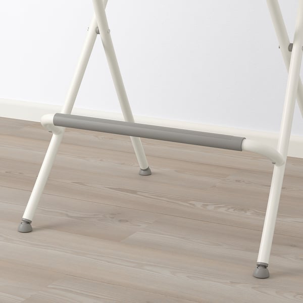 A modern white bar stool with a grey footrest, designed for easy storage and stability.