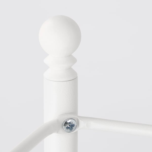 White metal fixture with rounded top.