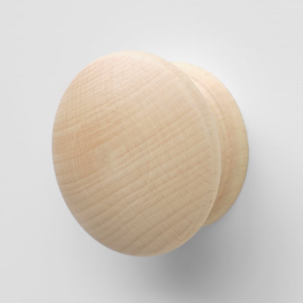 Wooden sphere coat hook, light colour, smooth, wall-mounted.