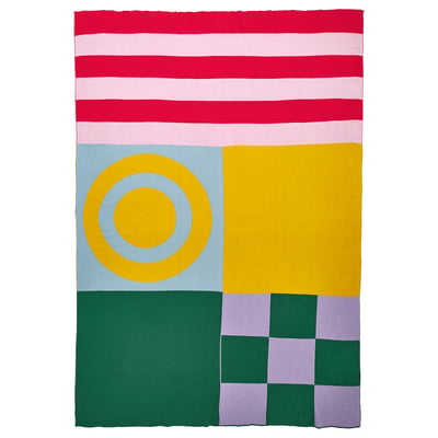 Colourful geometric blanket with stripes and circles. Yellow, pink, green, and red patterns. Cotton material, square shape.
