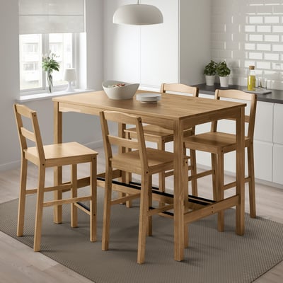 HÄGERNÄS light wood square dining table and four chairs. Compact for small spaces, fits neatly under window, near kitchen counter.