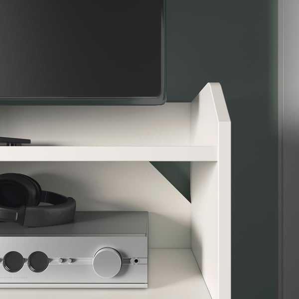 Modern white tv stand with slim profile; supports flat screens, includes shelf for electronics.