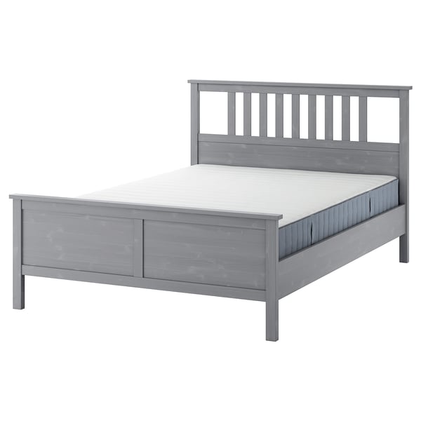 Grey HEMNES wooden bed with white mattress, sleek design, clean lines.