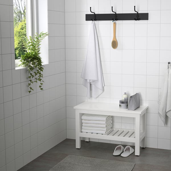 Minimalist bathroom: HEMNES bench with towels, hooks with towel and brush, plant by window