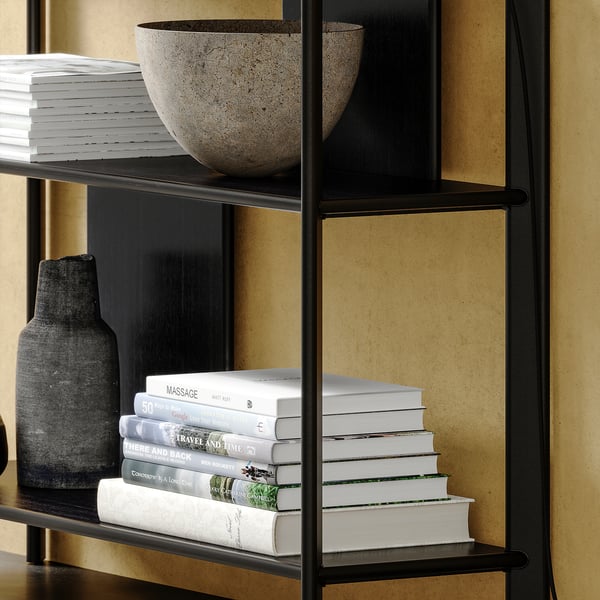 Black metal bookshelf with bamboo shelves, holding books, a black vase, and a grey bowl.