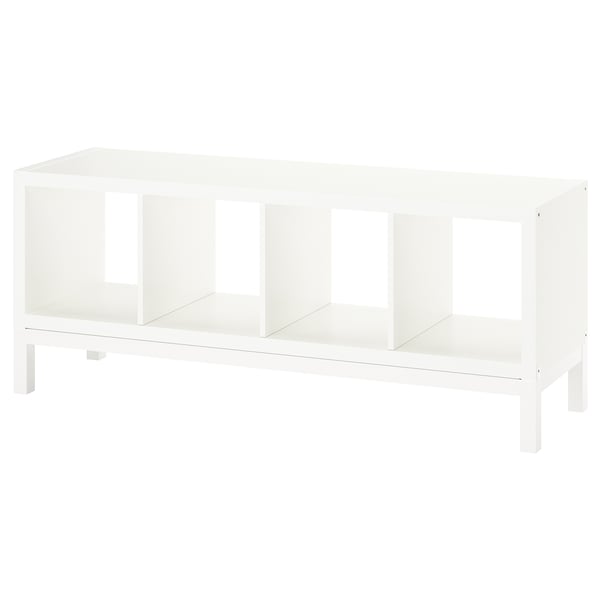 A white KALLAX shelving unit with an airy design. It open compartments and a light underframe.