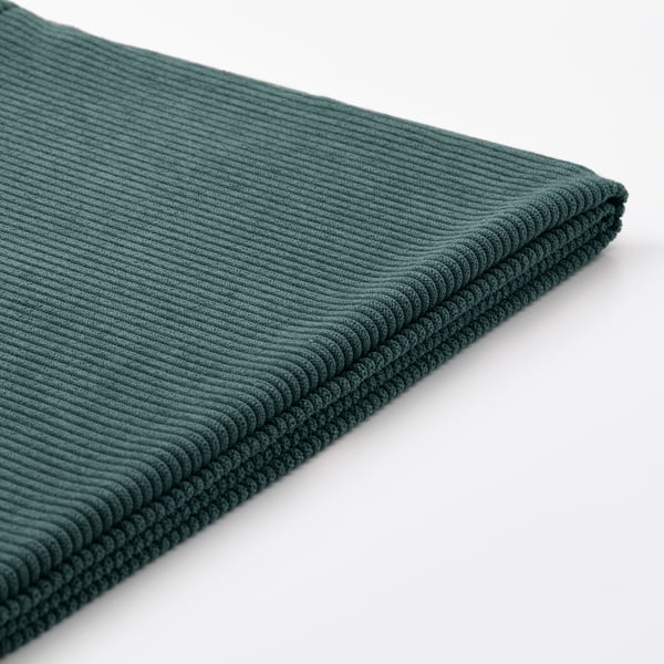 A close-up of a green fabric, likely a sofa cover, featuring a textured, ribbed pattern in soft, durable kelinge fabric.