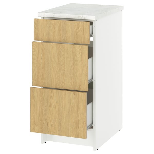 KNOXHULT white and oak kitchen unit with three drawers and marble worktop.