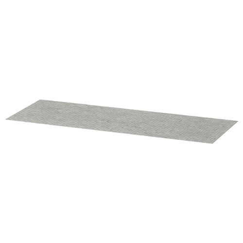 A grey KOMPLEMENT drawer mat, rectangular, made of polyester with a dotted surface design.