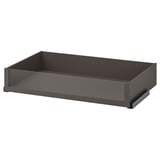 An empty, dark grey KOMPLEMENT drawer with glass front, rectangular shape, and sleek design.