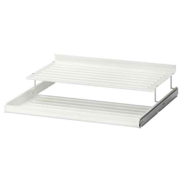 A white KOMPLEMENT metal shoe shelf with alternating levels to maximise storage space.