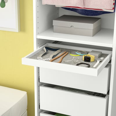 White wardrobe with pull-out tray showing jewellery organiser containing watches, bracelets, and other accessories.