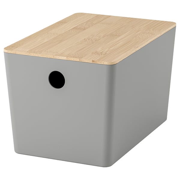 The KUGGIS box is grey with a natural bamboo lid, rectangular and sleek, suitable for storing small items.