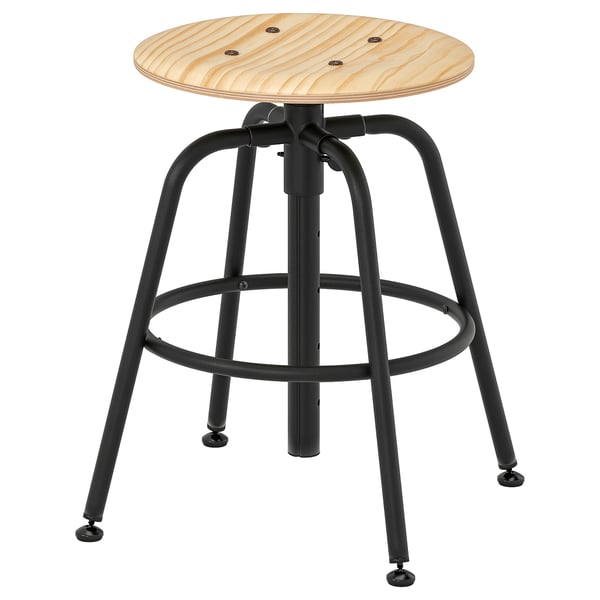 A KULLABERG stool with a light wood seat and black metal legs. Its adjustable and has an industrial design.