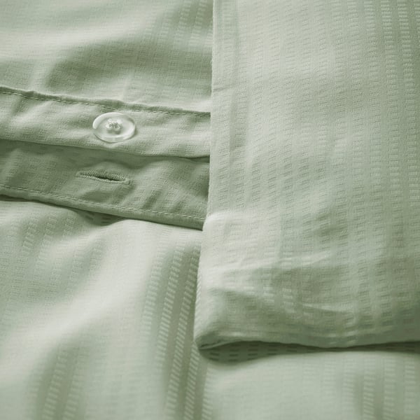 Green duvet cover set with button closure, smooth lyocell, ideal for warm nights.