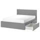 Modern grey MALM bed with clean lines, raised headboard, and smooth-gliding under-bed storage drawers.