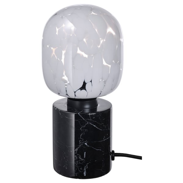 MARKFROST lamp: round white globe on black marble base, elegant and modern.