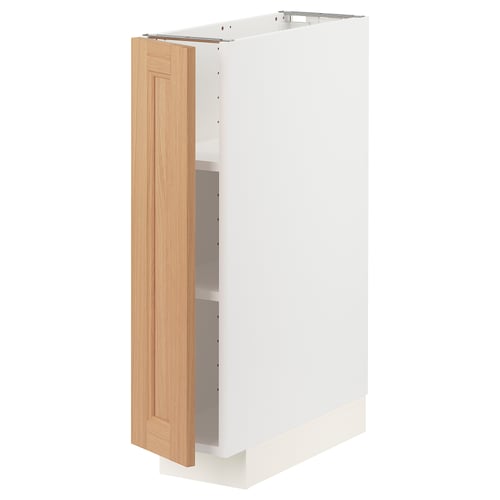 A white ikea METOD kitchen cabinet with an oak door and adjustable shelves.
