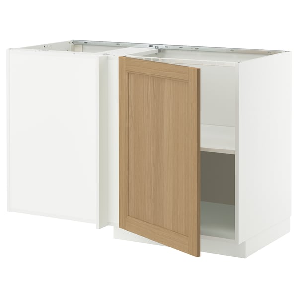 Ikea METOD kitchen unit in white with oak door open, showcasing shelf inside.