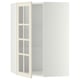 A white METOD kitchen corner cabinet with glass doors, featuring a traditional design with adjustable shelves.