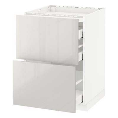 White METOD kitchen cabinet with glossy drawers, sleek design.
