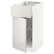 White high-gloss METOD kitchen unit with open drawer and shelves.