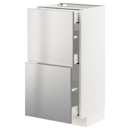 Displays a white METOD kitchen cabinet with stainless steel doors and drawers, featuring a sleek, modern design.