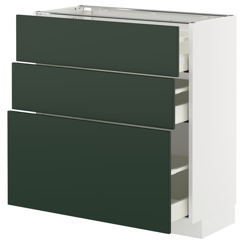 A modern kitchen unit. It three dark green drawers and a white frame. The drawers are sleek and extend fully for easy access.