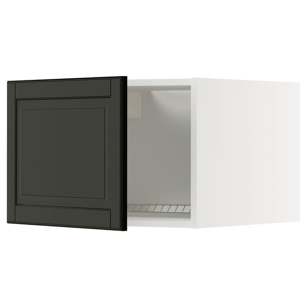 Modern black and white kitchen cabinet with dark door, sleek design.